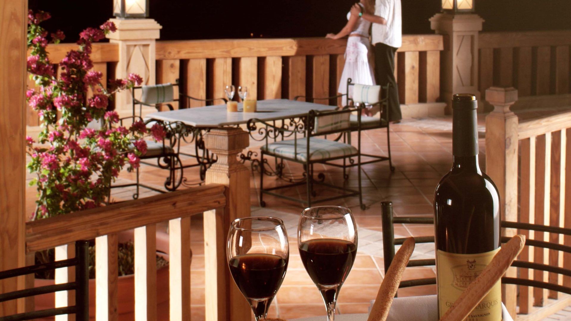 A Dining Table With A Glass Of Wine