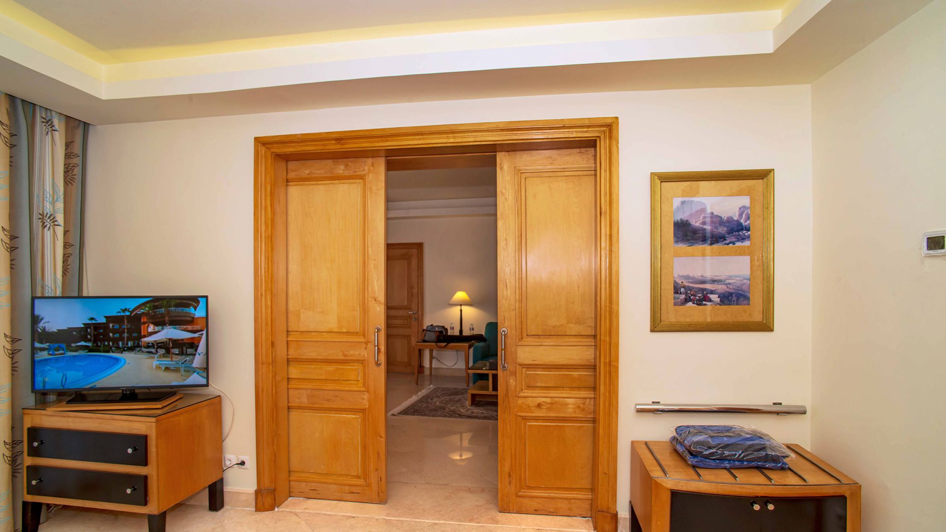 A Bedroom With A Wooden Door